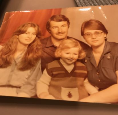 photo of Dr Gleb as young child with his older sister, father, and mother