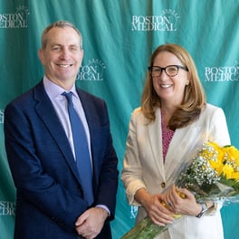 BMC President and Chief Quality Officer posing at campus event 