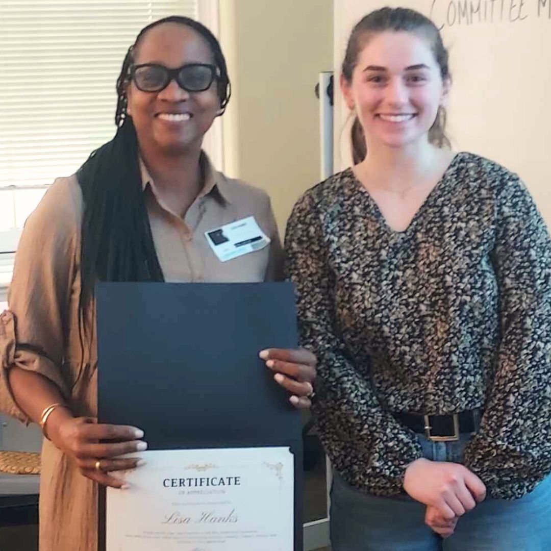 Image of Lisa Hanks and Victoria Barreira at final IRIS Leadership Committee smiling