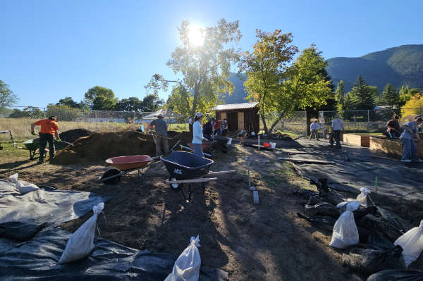 A team of volunteers prepares the site for the East Missoula Community Garden, which opened in May after four years of planning. (Photo credit: Erika Hickey)