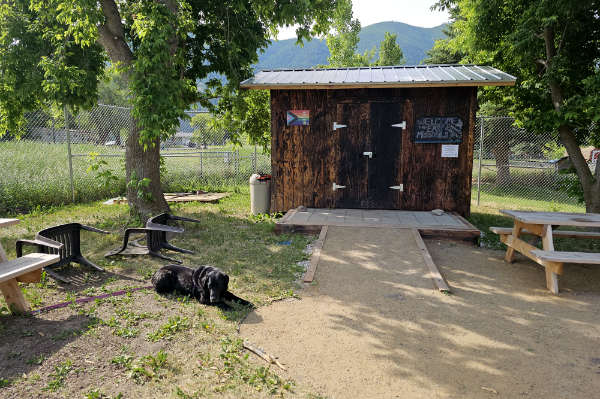 A tool shed built by Habitat for Humanity for the East Missoula Community Garden. Erika’s dog, Balloon, usually comes to the garden with her. (Photo credit: Erika Hickey)