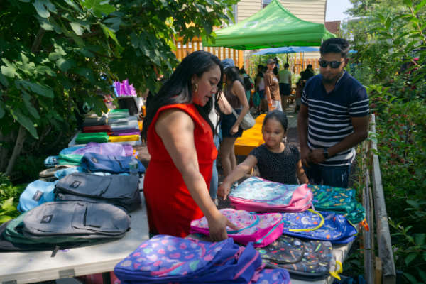 Once a year before school starts, the Glover Street Garden hosts a day of free backpacks, school supplies and books. The line to get into the garden stretches for a city block.