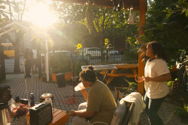 The new shaded picnic tables are essential in the heat of summer, in a neighborhood with little accessible green space. Residents celebrate birthdays here and gather for group Sunday suppers.