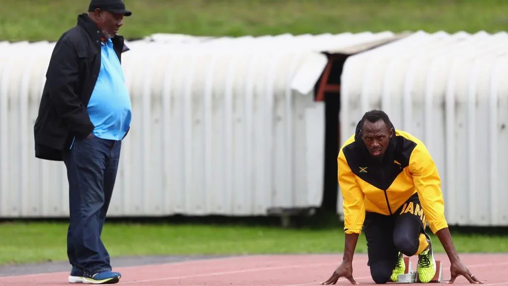 Usain Bolt met zijn coach 