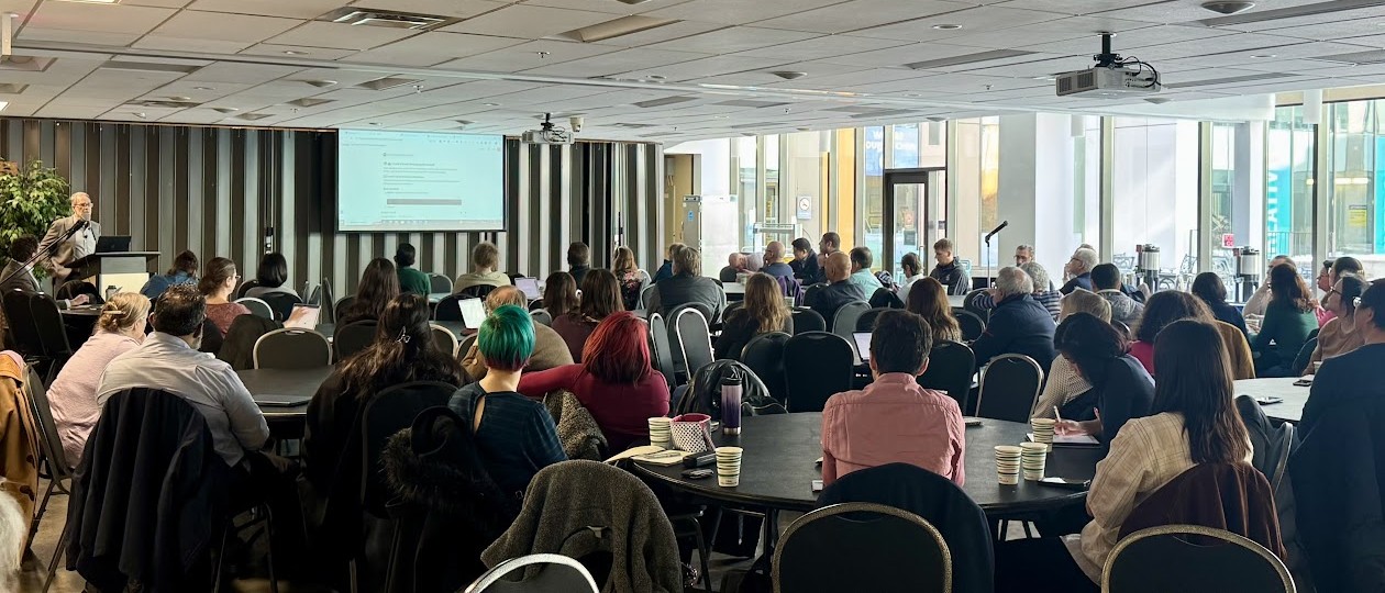 Dr. Risvold speaks to a crowd at the GenAI workshop series in February 2025. Dr. Risvold speaks to a crowd at the GenAI workshop series in February 2025.