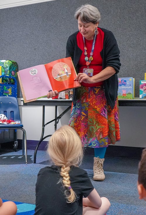 Library staff reading to young children