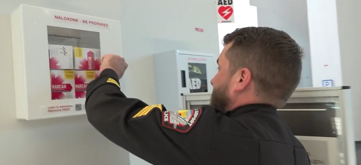 Airport worker opening Narcan case Airport worker opening Narcan case