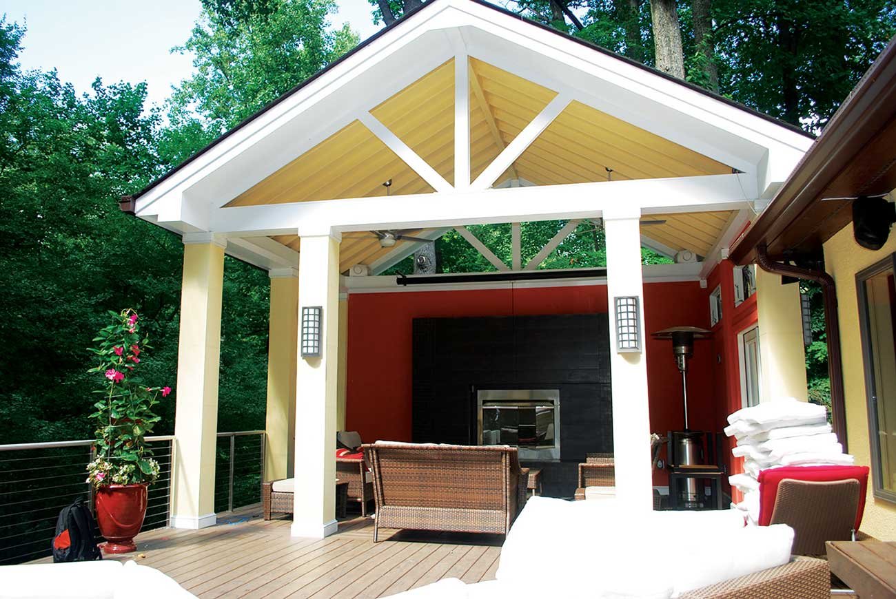 Custom deck with loggia and fireplace attached 