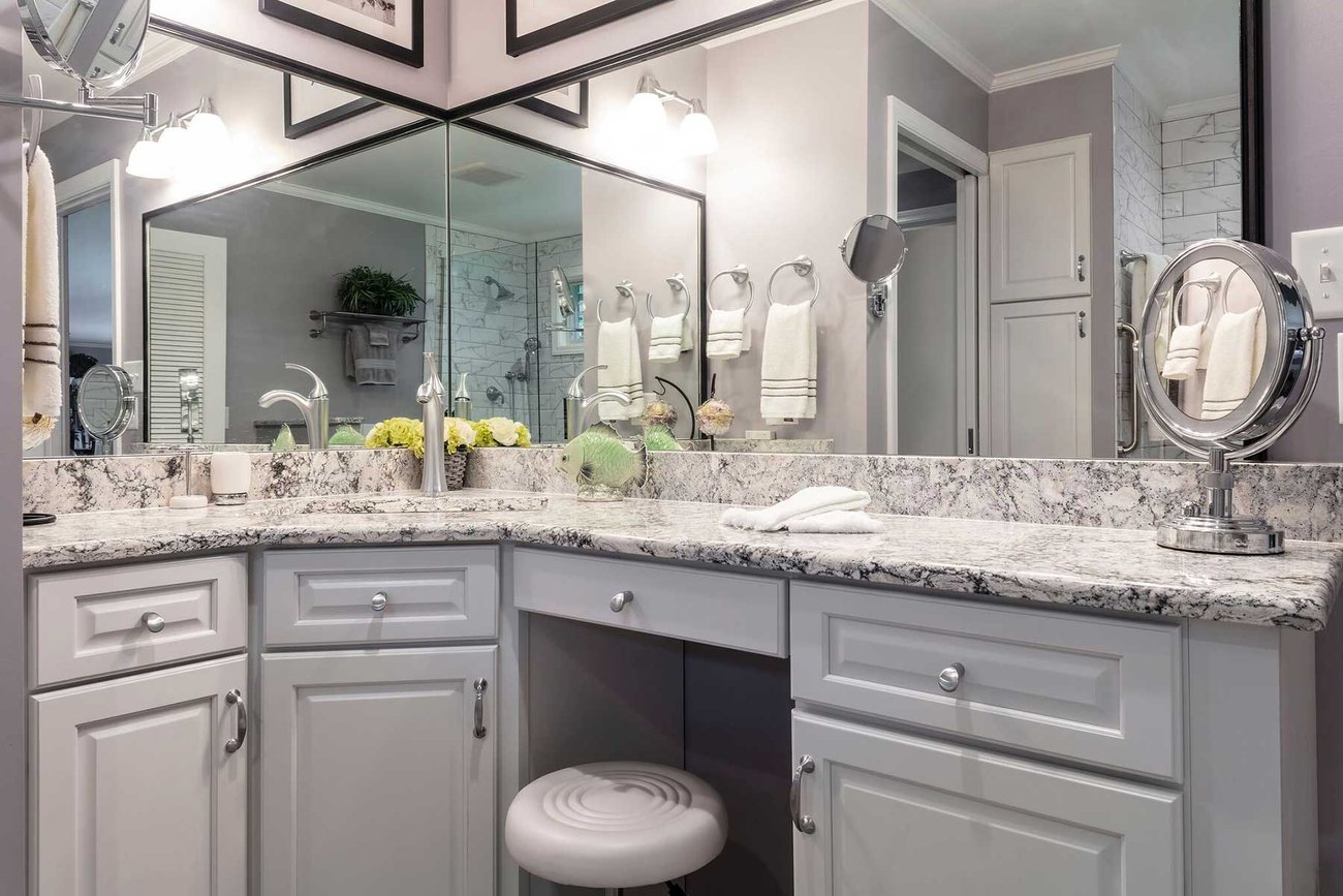 Luxury bathroom remodel with marbled Cambria countertop and make-up counter area