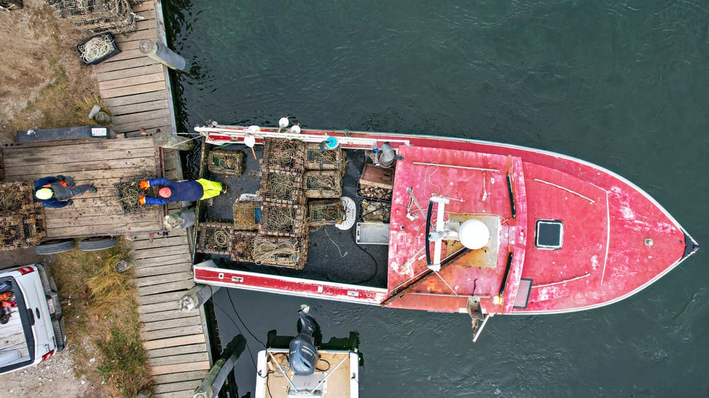 boat in the water from above boat in the water from above