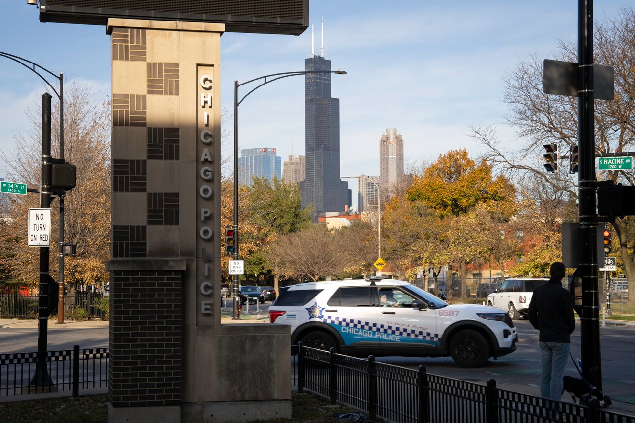 A police vehicle passes by the 12th District Chicago Police Department in Illinois on Nov. 2, 2024. (Credit: Sarahbeth Maney/ProPublica) 