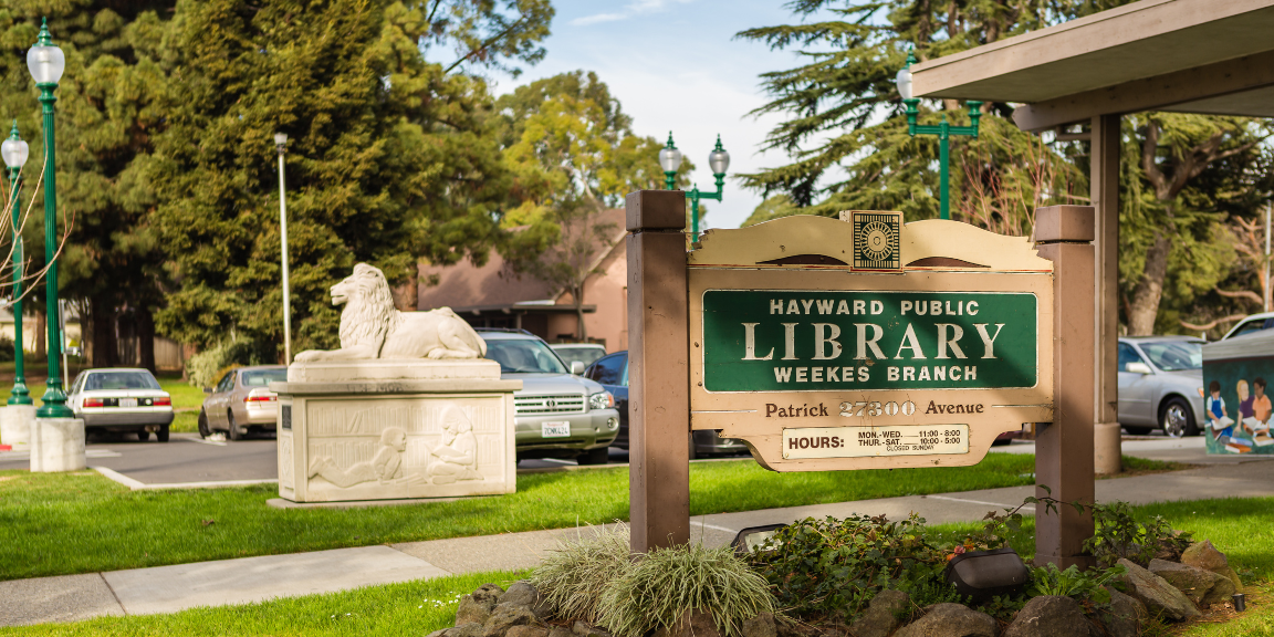 Photo of the sign outside of Weekes Branch Library.