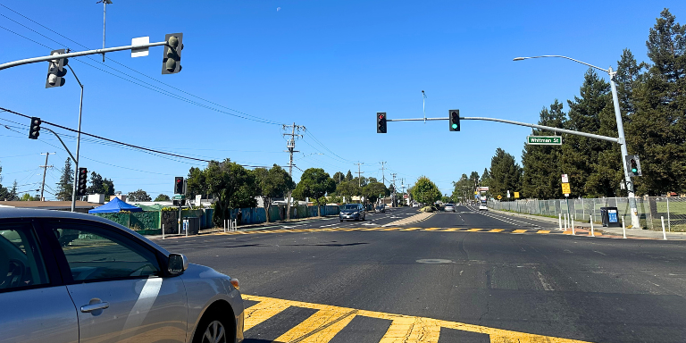 Photo of a car at at traffic signal on Tennnyson Road and Whitman Street. Photo of a car at at traffic signal on Tennnyson Road and Whitman Street.