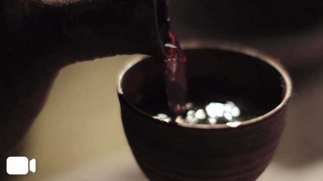 wine pouring into chalet