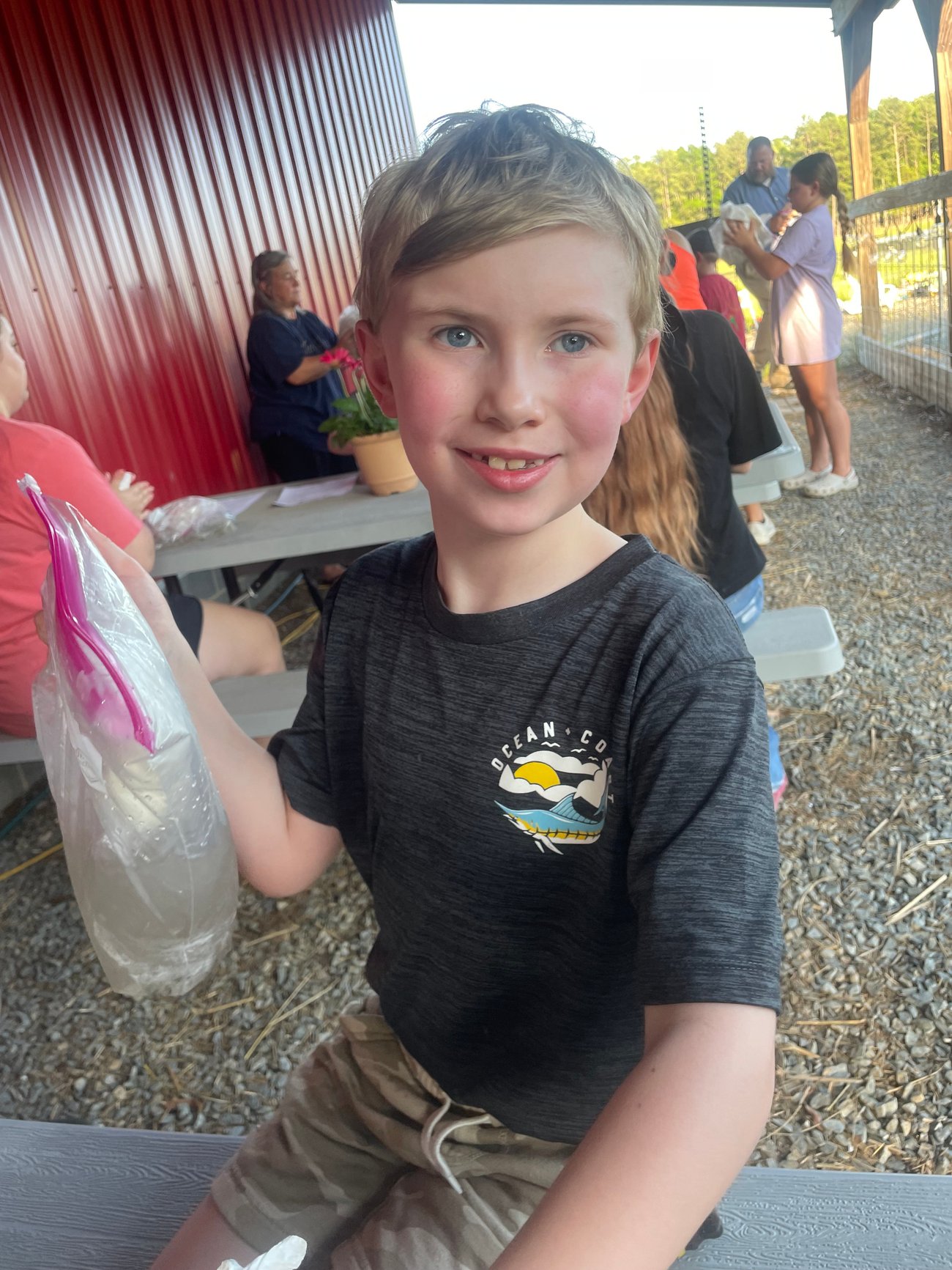 Image of a young kid holding bag