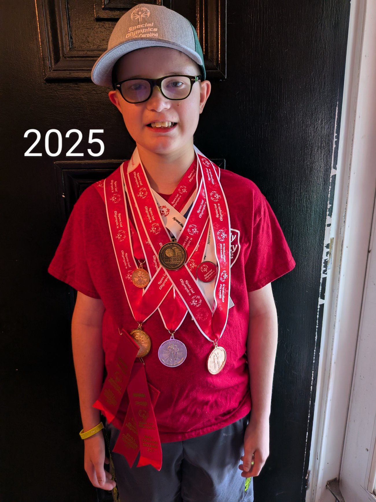 4-H member with medals from special olympics