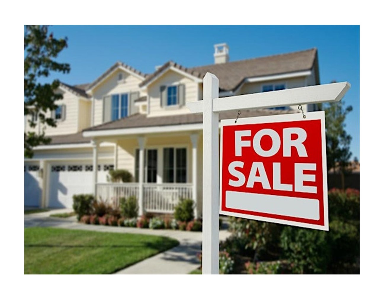 cream, two story house with a for sale sign in front yard