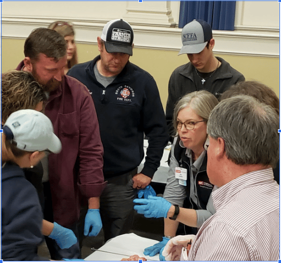Livestock producers examine cattle reproductive tracts