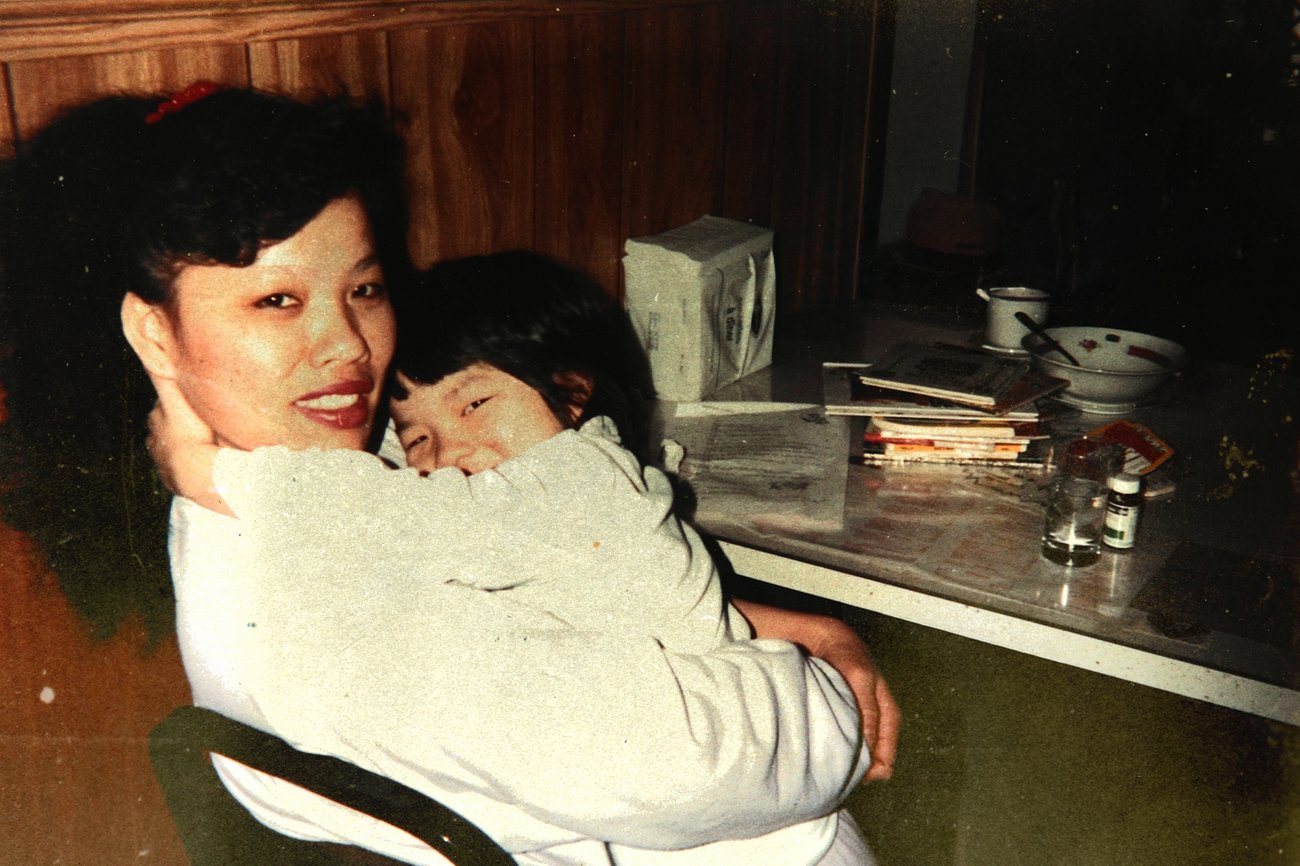 Photo of an Asian mother hugging her daughter.