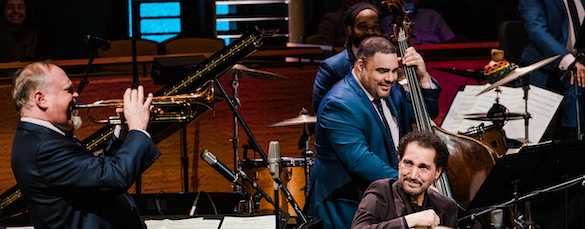 Naseer Shamma, seated, plays with the Jazz at Lincoln Center Orchestra at the Rose Theater.