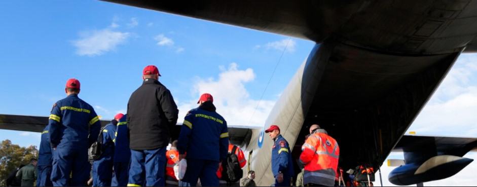 Greek firefighters wait to enter a military plane at Elefsina Air Force Base February 6, 2023. Greece is sending a rescue team to Turkey after deadly earthquakes there.