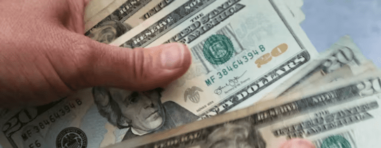 Twenty-dollar bills are counted on June 15, 2018, at North Andover, Massachusetts. AP/Elise Amendola, file