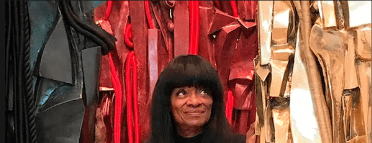 Barbara Chase-Riboud with her Malcolm X steles, Michael Rosenfeld Gallery, March 10, 2018. Nikitag94 via Wikimedia Commons