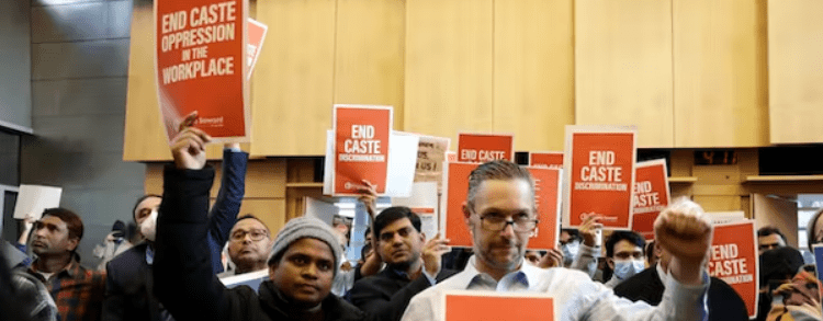 People react to discussion of the ordinance to add caste to Seattle's anti-discrimination laws in the Seattle city council chambers, February 21, 2023. AP Photo/John Froschauer