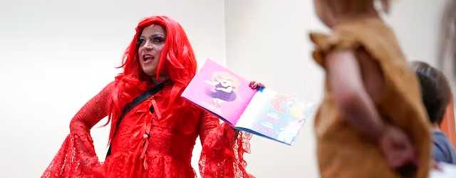 A drag queen who goes by the name Flame at a public library at New York, June 17, 2022. AP Photo/Seth Wenig