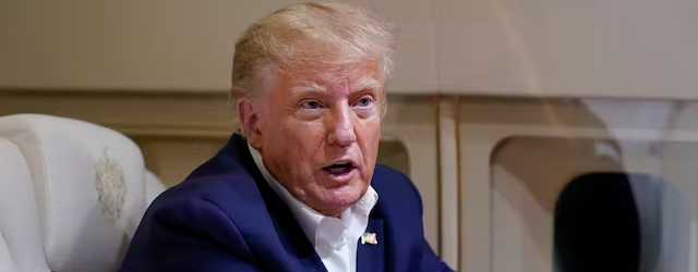 President Trump speaks with reporters while in flight after a campaign rally at Waco Regional Airport, March 25, 2023. AP/Evan Vucci