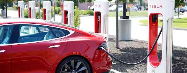 A Tesla Model S is plugged in at a vehicle charging station, Seabrook, New Hampshire, August 24, 2018. AP/Charles Krupa, file