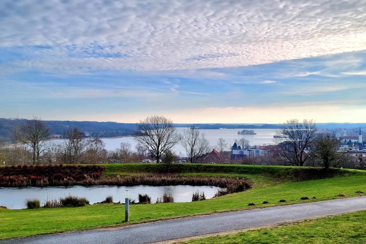 Photo of Sillebro Ådal showing a wooden bridge crossing a lake