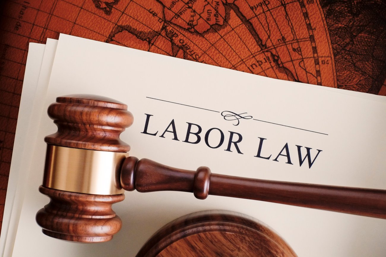 brown judge's gavel on top of a stack of papers titled Labor Law