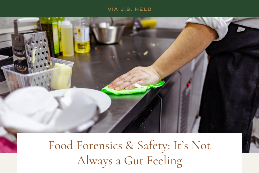 Via J.S. Held image: Chef cleaning off kitchen table with green rag Via J.S. Held image: Chef cleaning off kitchen table with green rag