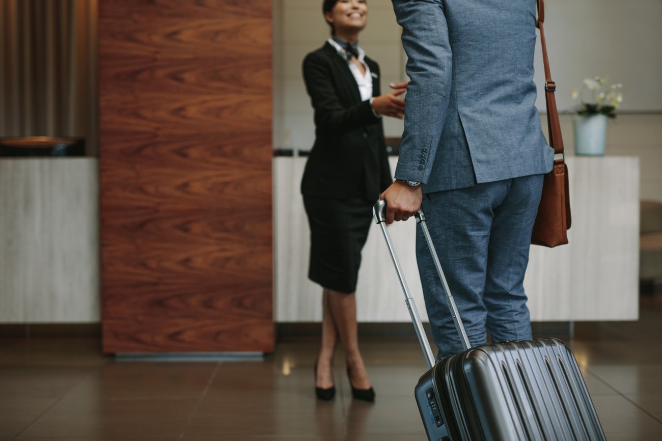  Concierge welcoming guest at hotel lobby