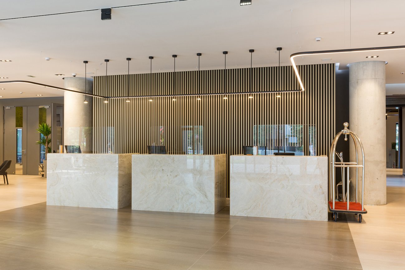 Interior of a hotel lobby with reception desks