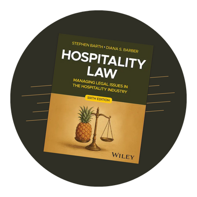 Hospitality Law 5th Edition Cover against a rust brown circular
background