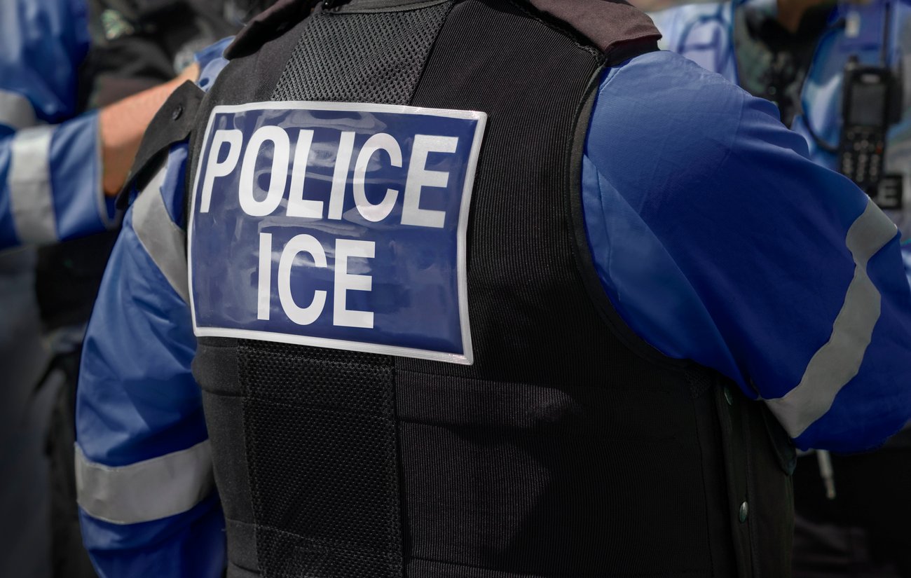 Ice Police agents - Immigration and Customs Enforcement.
Close-up of POLICE ICE marking on the back of worn by a trio of DHS police officers at the scene of an incident.