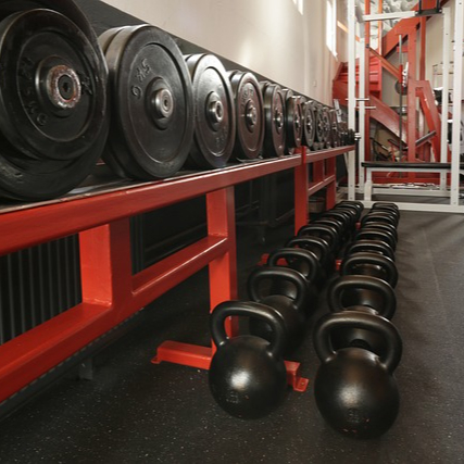 Racks of dumbbells and free weights at the gym