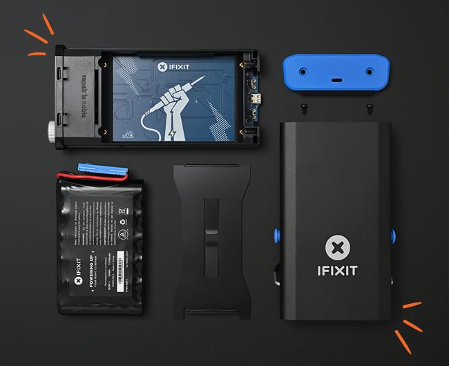Image: Flatlay of the FixHub Soldering Station and it's parts. Parts consisting of the case, motherboard, face, screws, and battery pack. 