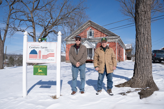 Mark Shultz, left, and Mike Leighow outside Leighow's Century Farm. (Photo credit: Ben Seal)