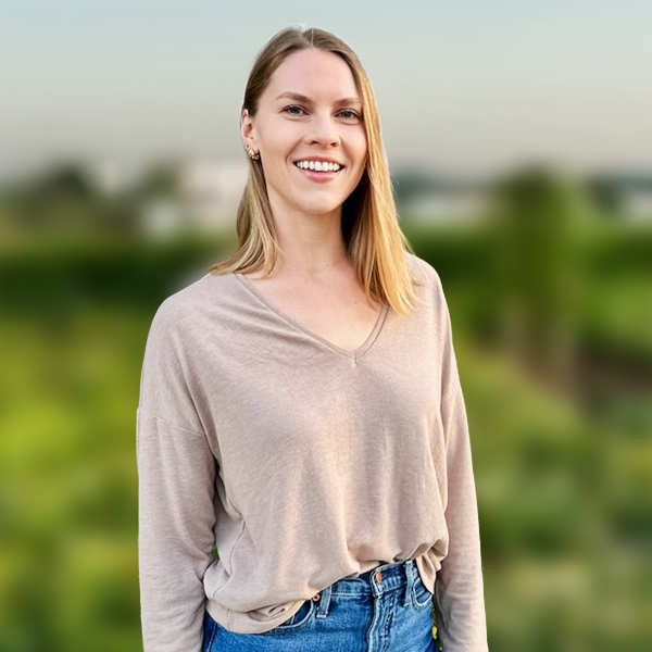 Sarah Zuhlsdorf standing in a field