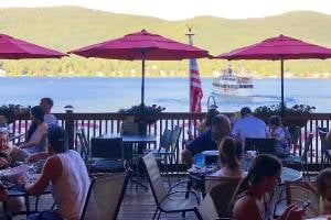 patio dining with lake george backdrop