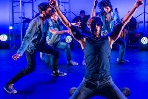 actors dancing on stage