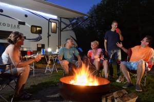 family around campfire