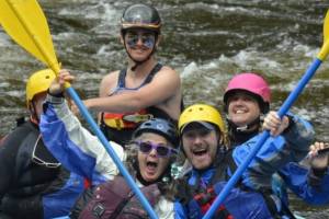 happy people whitewater rafting