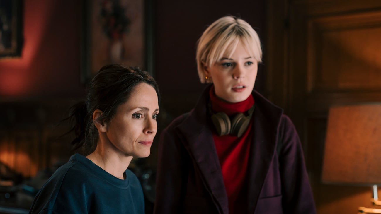 Bea and Patience look at something off screen