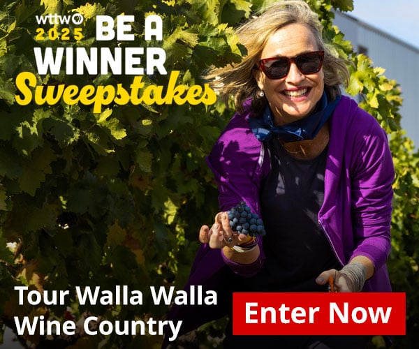 Ad: WTTW 2025 Be A Winner Sweepstakes - Tour Walla Walla Wine Country - Enter Now! Pictured: Woman smiling in vineyard with a bunch of grapes in her hand