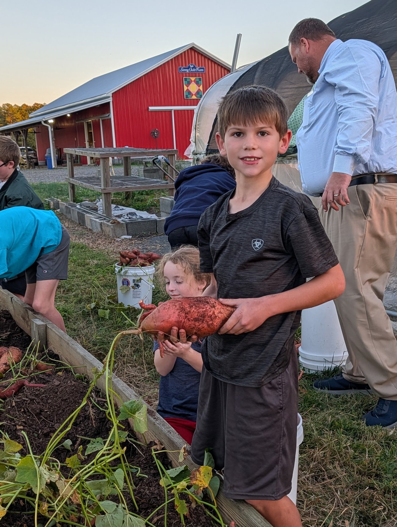 child holding sweet potato