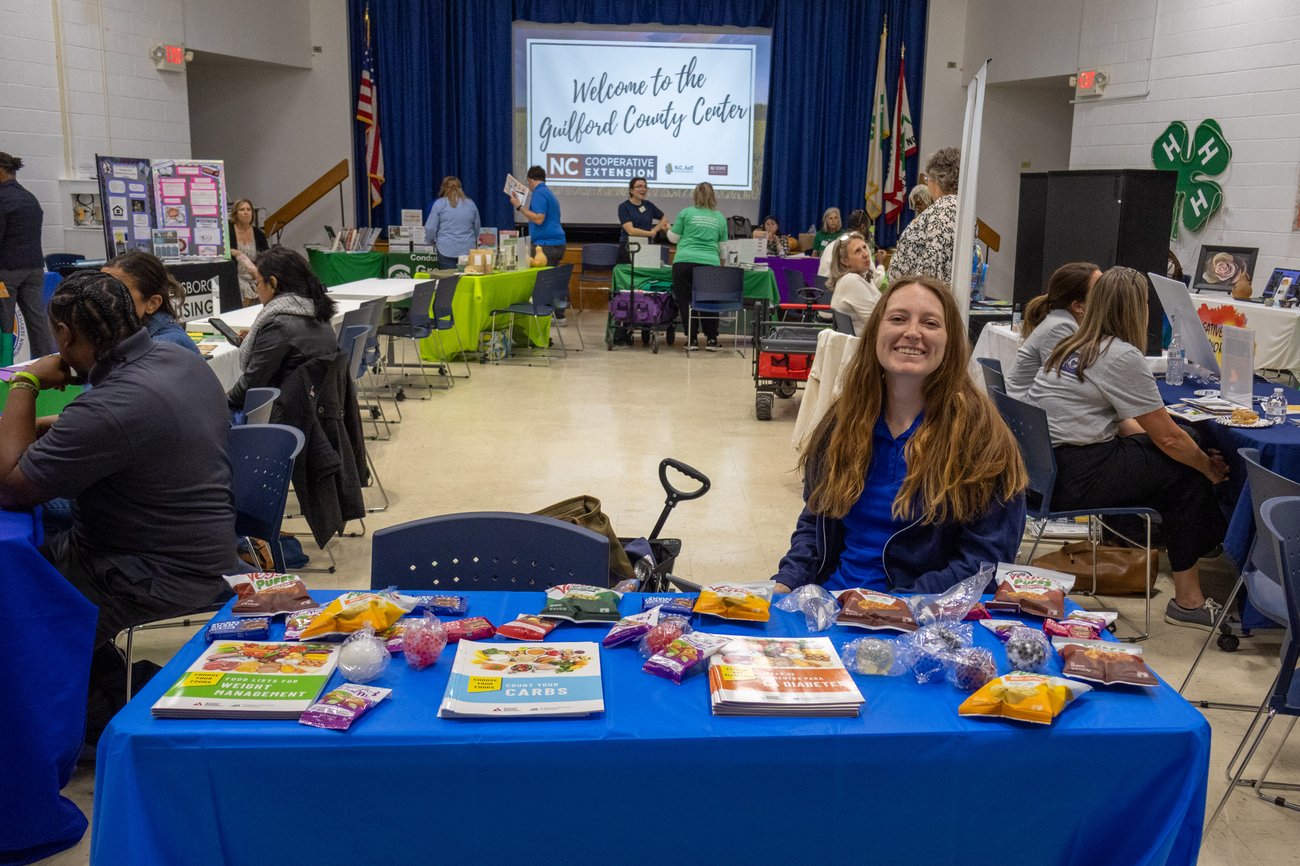 Photo from NC Cooperative Extension Guilford County Center Open House. People conversing and visiting information tables in the lobby. Photo from NC Cooperative Extension Guilford County Center Open House. People conversing and visiting information tables in the lobby.